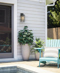14 Inch Double Cage Outdoor Wall Lights 2 Pack Exterior Porch Lantern Sconces mounted beside a door on a home.