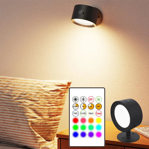 Rechargeable Battery Operated Wall Sconce Twin Pack With 3 White And 13 RGB LED Lights illuminated beside a bed with remote
