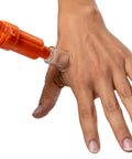 Ven Ex Snake Bite Kit And Bee Sting Kit with Portable Venom Extractor applying suction on hand outdoors