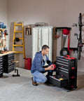 Man using Unfitted Black Tool Chest With 22.1 By 11 By 10.3 Inches Dimensions For Basement, Garage, Workshop And Hobby Room