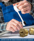 Front view: lead-free brass NPT bushing, 1-1/4 in M x 1 in F, hex head, being installed.