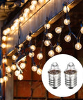 Killer 4 Pack E10 Miniature Screw Base Light Bulbs For Model Kits And Electronics 2.2 Volt Warm Yellow Glow 0.55 Watt Durable Glass displayed among string lights.