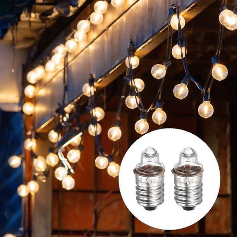 Killer 4 Pack E10 Miniature Screw Base Light Bulbs For Model Kits And Electronics 2.2 Volt Warm Yellow Glow 0.55 Watt Durable Glass displayed among string lights.