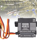 Hardcore Brushless Servo Featuring Heavy Duty Metal Gears And Aluminum Body 45Kg Torque No Sweat Performance Compact Fit For Rc Cars Trucks And Off Road Rigs, showing connected wires and digital display.