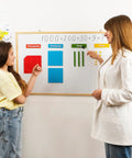 Teacher explaining math with Jumbo Colorful Magnetic Base Ten Blocks Set 131 Plus 4 For Math Fun Hands On Place Value Learning Base Ten Counters Math Manipulatives For Kids Classroom Must Haves on whiteboard.