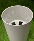 Top view of Aluminum Putting Green Cups 6 Inch Deep, 3 Pack Bundle, USGA Regulation 4.25 Inch Diameter, on green grass