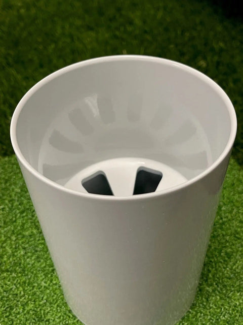 Top view of Aluminum Putting Green Cups 6 Inch Deep, 3 Pack Bundle, USGA Regulation 4.25 Inch Diameter, on green grass