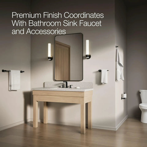 Modern bathroom with light wood vanity, black faucet, and Betello Left Hand Trip Lever Matte Black For Betello Toilets Built To Last.