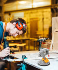 Multi Functional Rotating Bench Vise With Swivel Tabletop Clamp in use for woodworking in a workshop setting.