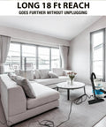 1.5 Gallon 2.0 Peak HP All Around EZ Wet Dry Vacuum in living room with long reach cord, sofa, coffee table, and window view