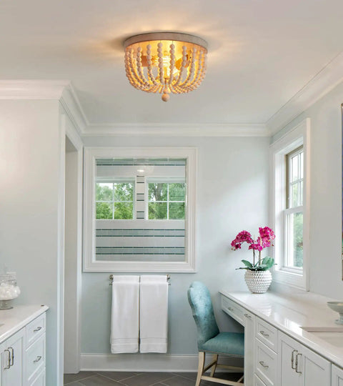 Boho Wood Bead Chandelier With Oak Finish Two Light Semi Flush Mount in bright bathroom setting, ceiling fixture glowing