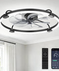 24 Inch Low Profile Ceiling Fan With Brushless Dc Motor And Smart App Remote Brings Fresh Cooling Vibes To Bedrooms Or Living Rooms While Featuring Stepless Dimmable LED Light And Tunable Warm Cool Tones In Matte Black view from below with remote control and app.