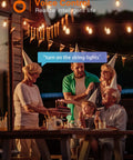 Family enjoying evening party under 96ft Smart Outdoor String Lights With Remote And App Control Dimmable Patio Lit Vibe Lights.