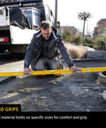 Man using Stabila Type 96M 72 Inch Magnetic Level for pro grade framing accuracy on outdoor construction site.