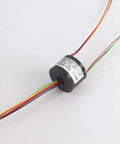 7mm Slip Ring Through Hole With 6 Channel 2A Rating, 50 RPM, 220 VAC DC, gold contacts, shown with colored wires and label