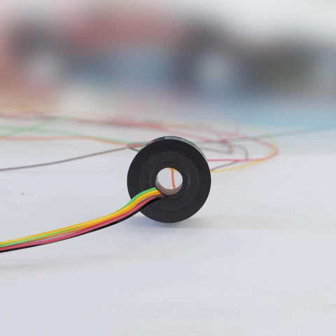 Side view of 7mm Slip Ring Through Hole With 6 Channel 2A Rating, 50 RPM, 220 VAC DC, showing gold contacts and colored wires.