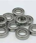 Group of 8.1x16x7mm Ball Bearing - Shielded - Miniature, chrome steel, double metal shields, displayed on a flat surface.