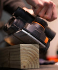 Close-up of a powerful 8-Amp hand planer delivering smooth, precise cuts on wood with a 4-3/8 inch cutterhead, featuring dual dust ports.