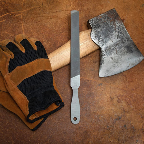 8 Inch Rectangular Axe File With Double Cut Roughing Side And Single Cut Finishing Edge next to axe and gloves