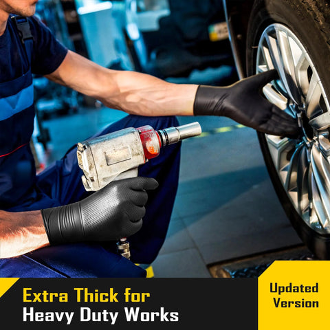 Mechanic wearing 8 Mil Disposable Nitrile Gloves With Diamond Textured Grip 100 Count while fixing car wheel