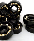 8-Pack Skateboard Black Open Bearings - Bronze Cage 8x22x7mm featuring black exterior and bronze ball cage design.