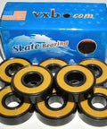 8-Pack Skateboard Black Bearings - Bronze Cage & yellow Seals 8x22x7mm arranged in front of their box.