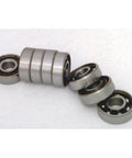 8 Skateboard Chrome Steel Open Ball bearing - Nylon Cage in various angles displaying high-strength chrome steel construction.