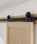 80" Sliding Barn Door Hardware Kit installed, showing black T shape hanger on top mount track for single wooden door.