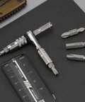 Ultra Compact One Quarter Inch Ratchet Wrench For Tight Spaces Stainless Steel EDC Tool with double ended bits on a surface