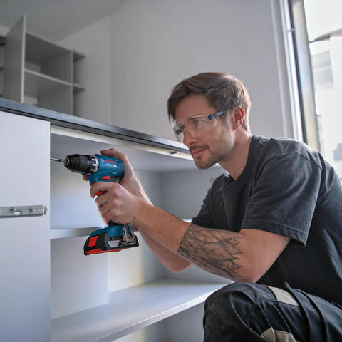 Man using Badass 18V Cordless Drill Driver With Brushless Motor And Smooth Shifting Dual Speed for assembling shelves.