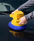 5 To 6 Inch Car Polisher Pad Bonnet Set With 15 Buffing Pads, 10 Microfiber Wax Pads And 5 Woolen Pads, Elastic Band Pro Grade Fit For Easy Waxing, Polishing And Dust Removal On Painted Surfaces. Blue bonnet on a yellow car polisher being used on a black painted hood.