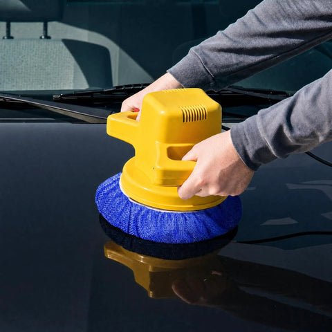 5 To 6 Inch Car Polisher Pad Bonnet Set With 15 Buffing Pads, 10 Microfiber Wax Pads And 5 Woolen Pads, Elastic Band Pro Grade Fit For Easy Waxing, Polishing And Dust Removal On Painted Surfaces. Blue bonnet on a yellow car polisher being used on a black painted hood.