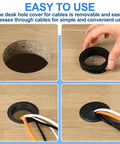 2 Pack 3.5 Inch Desk Grommets Black ABS Hole Covers Detachable Flexible Wire Caps For Cords in use with cables on a wood desk.