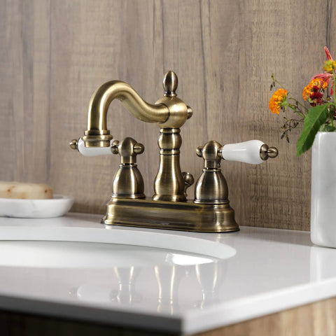 Antique Brass 4-Inch Centerset Bathroom Faucet Deck Mount 3-Hole Setup With Drip-Free Washerless Cartridge on counter