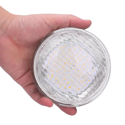 Person holding PAR36 LED 12 Watt Outdoor Garden Landscape Lighting Low Voltage 12V DC AC IP65 Flood Lamp 3000K Warm White No Transformer Required