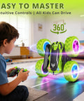Child playing with 2.4GHz Off Road RC Car With Dual Sided 360 Degree Roll, Four Wheel Drive, High Speed Stunt Racer, LED Headlights, Green Color