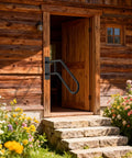 Heavy Duty U Shaped Hand Rail For Outdoor Steps, Black Wall Mount Stair Support With No Sweat Install Kit on a log cabin entrance.