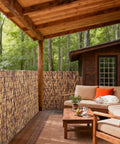 Natural Reed Fencing Roll Bamboo Privacy Screen For Patio Balcony Garden And Yard Outdoor Privacy Fence Roll Decorative Reed Screen For Backyard Vibe 3.8 Ft By 16.4 Ft on a cozy patio with forest view.