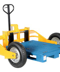 Heavy Duty All Terrain Steel Pallet Truck With Pneumatic Tires And Smooth Steering Glides Over Rough Ground Loads Up To Two Thousand Five Hundred Pounds Without A Sweat On Thirty Two Inch Forks