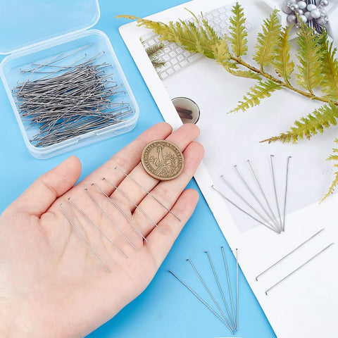 168 Count 304 Stainless Steel Flat Head Eye Pins 2 Inch Long 23 Gauge Jewelry Making Findings For DIY Necklaces Bracelets And Earrings Durable Beadwork Supplies For Crafting, pins in hand beside coin