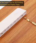 Heat Set Insert Tip Set For Threaded Inserts M2 To M8, 7 Brass Tips For Soldering Irons, shown on wooden surface