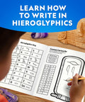 Ancient Egypt Dig Kit With Gems And Replica Artifacts For Hands On Archaeology Fun, Excavation Bricks Shaped Like Pyramid Sphinx And Pharaoh, Includes Three Real Gemstones And Three Detailed Artifacts, Learn Hieroglyphics And History. child using hieroglyphics guide with dig kit