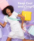 Woman with colorful picnic coolers, including Powder Blue 11 Qt Tag-Along Two Strapped Picnic Style Cooler With Hands Free Crossbody Strap.