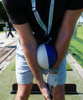 Golfer using Compression Ball Golf Swing Trainer For Perfect Impact And Forearm Connection on driving range for practice.