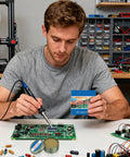 Man using lead free solder paste flux repair aid with quick melt bond for electronics jewelry copper circuit boards plumbing