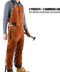 Man wearing Split Leg Leather Welding Apron For Men, Heat And Flame Resistant Cowhide Leather, showing pockets and hammer loops.