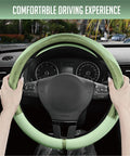 Upgrade Your Whip With This Fresh Green Patterned Steering Wheel Cover Crafted From Soft PU Leather Patchwork to deliver a comfortable grip.