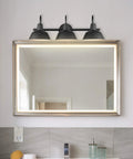 24 inch three light vanity fixture E26 base above mirror in bathroom from the Five Piece Matte Black Bathroom Accessory Set.