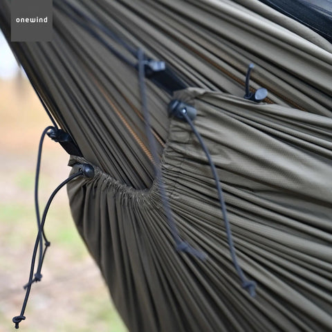 Close-up of Cozy Hammock Underquilt Protector Water Resistant Cover with breathable 1.1 oz nylon ripstop in OD green detail view