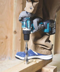 Person using Top Shelf 18V Lithium Ion Brushless Drill Driver With Electric Brake Led Work Light And 21 Torque Settings on wood.